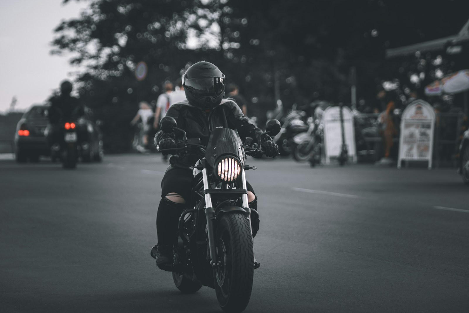 Motorcyclist riding on open road